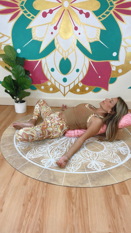 Desi Bartlett, MS CPT E-RYT Women’s Health Expert showing Supported Butterfly (Supta Baddha Konasana) pose