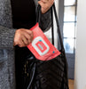 H. Soothe Hemorrhoidal Wipes being put in a bag by a mom