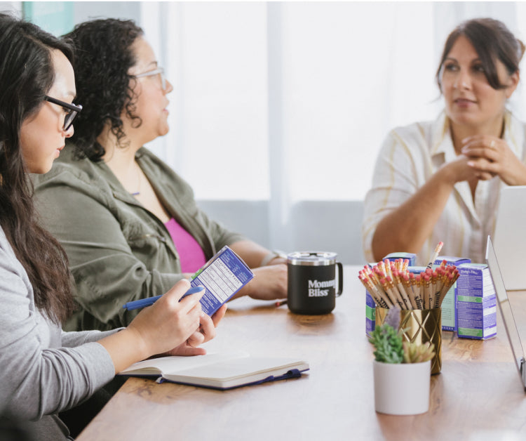 Three women having a meeting with their laptops and cellphones