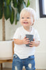 Sip Sip Hooray Happy Sippy Cup by Bella Tunno being held by a boy kid 