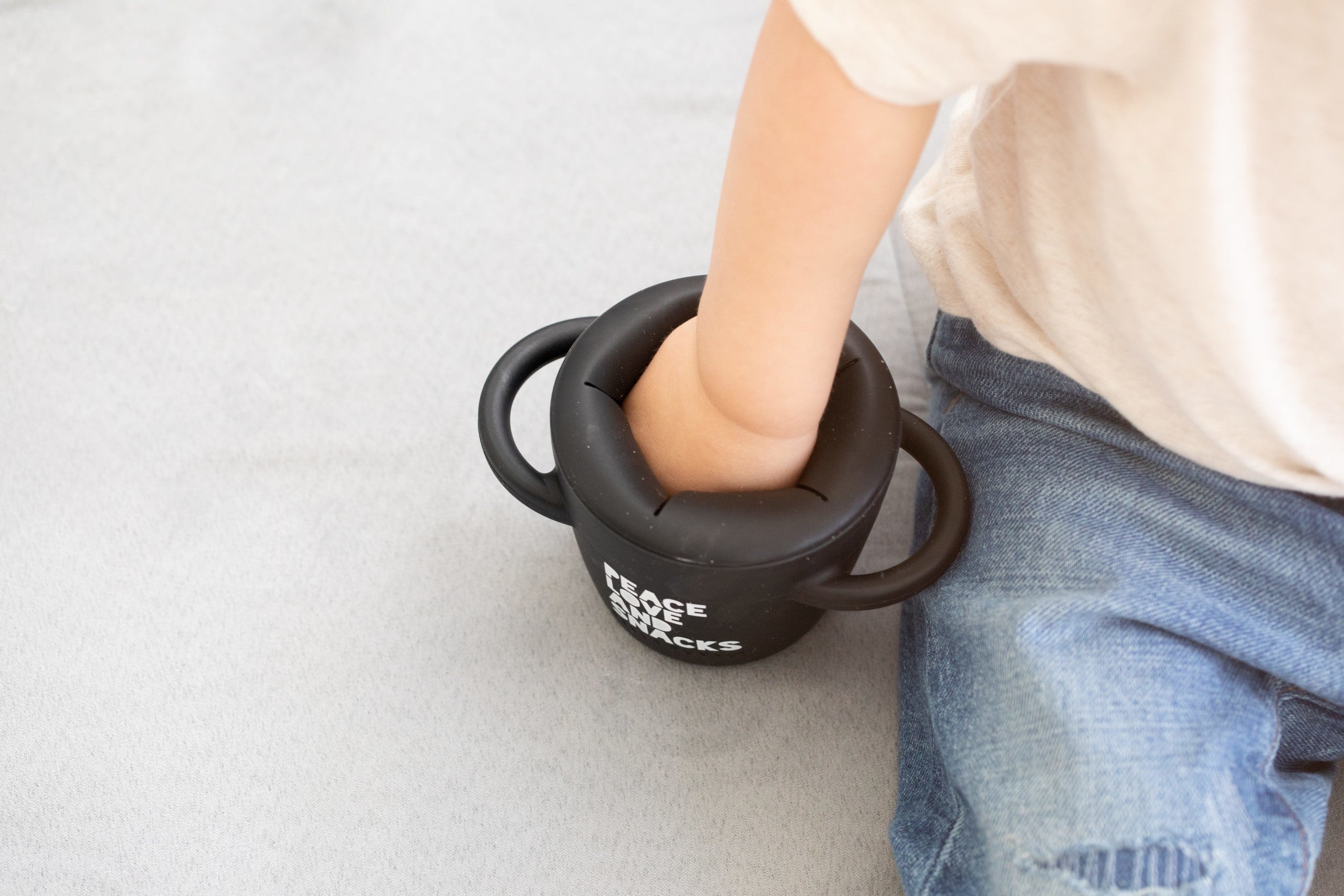 Peace Love Snack Happy Snacker by Bella Tunno's being used by a kid