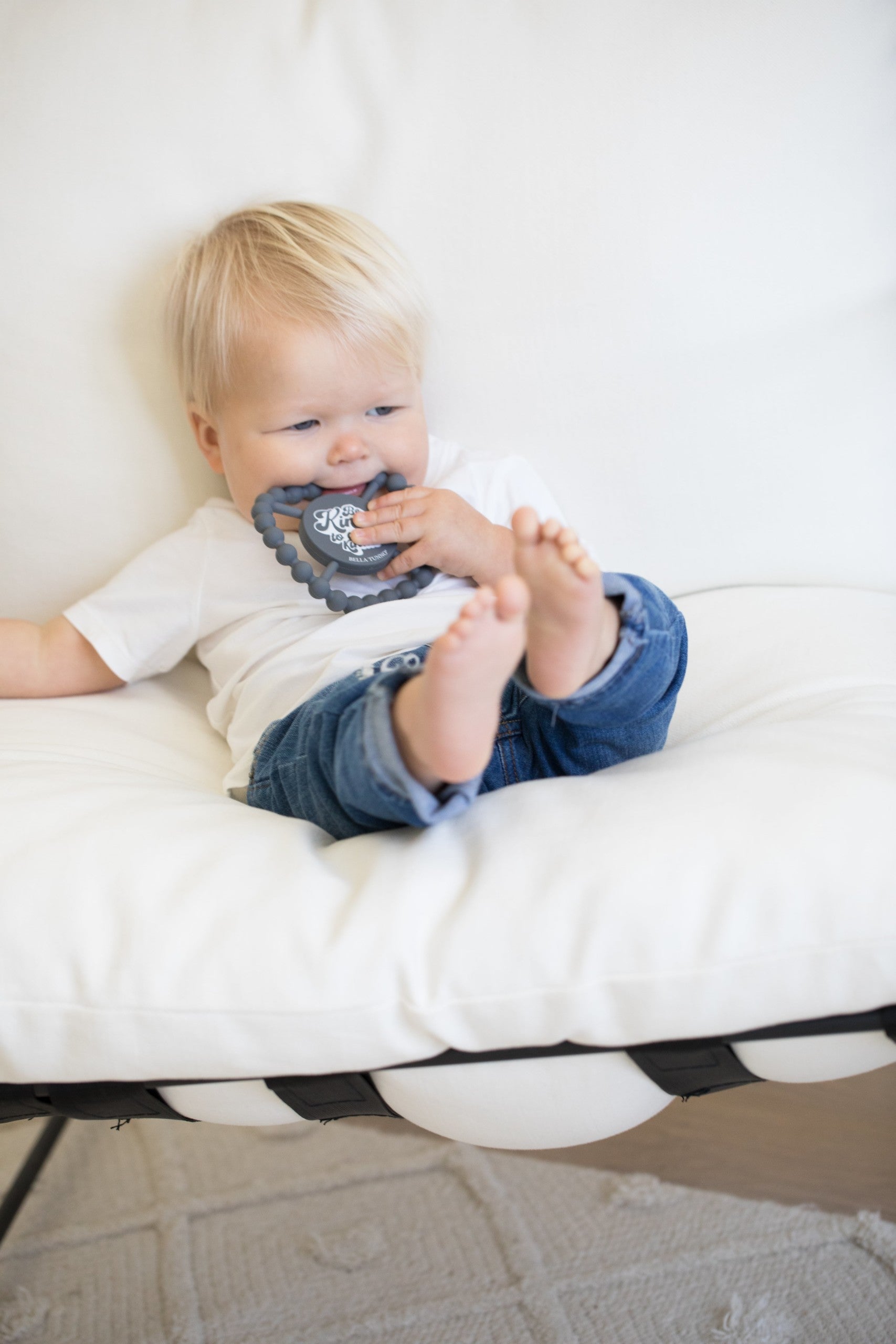 Be Kind to All Kinds Happy Teether by Bella Tunno being used by a baby boy