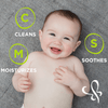 A smiling baby while lying down